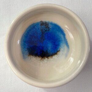 ceramic dish with blue glass interior